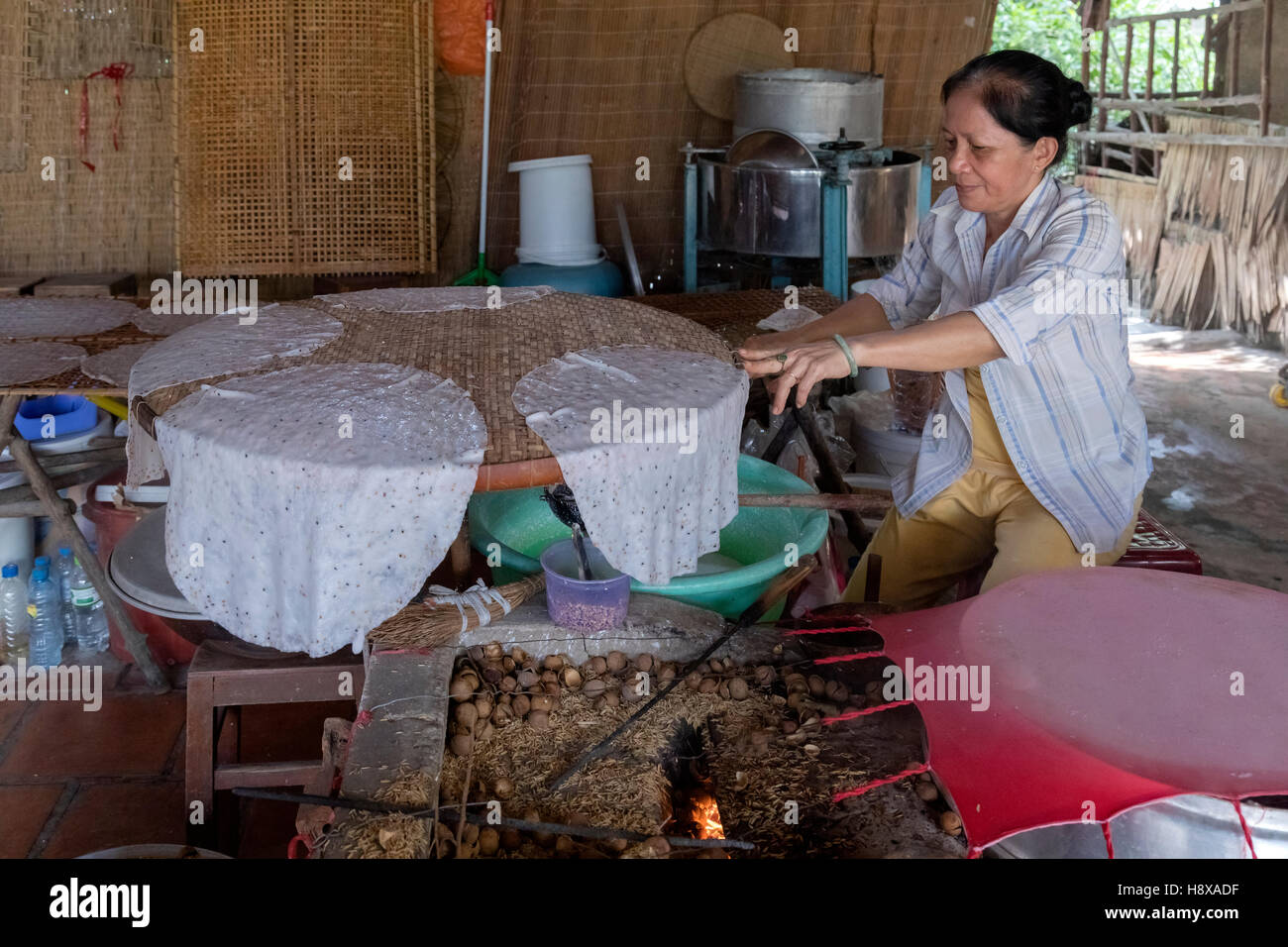 woman preparing rice noodles in Cai Be, Mekong Delta, Vietnam, Asia Stock Photo