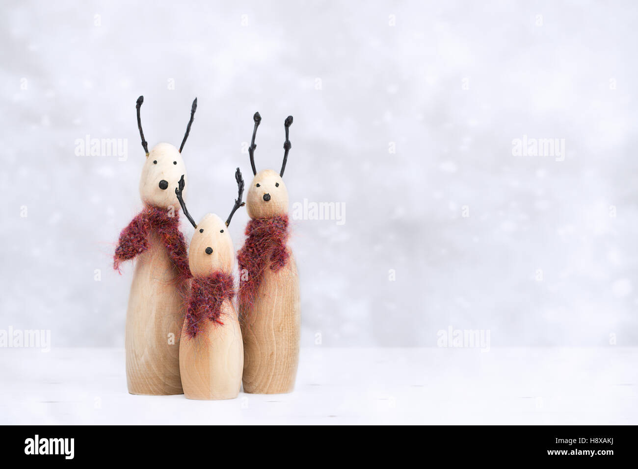Reindeer animal figures with knitted scarves Stock Photo