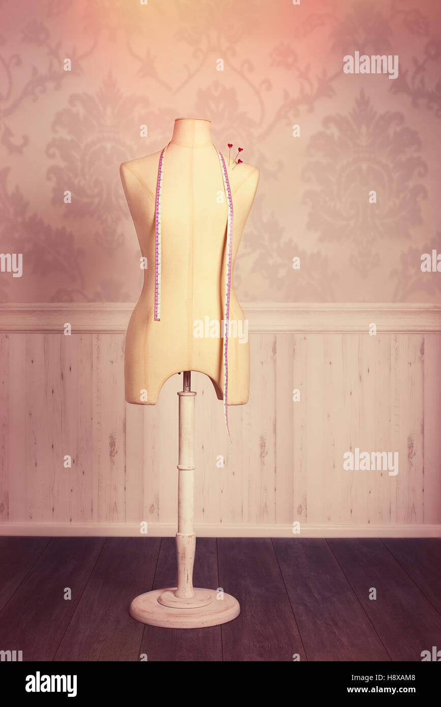 Tailors dressmaking dummy with tape measure and pins Stock Photo Alamy