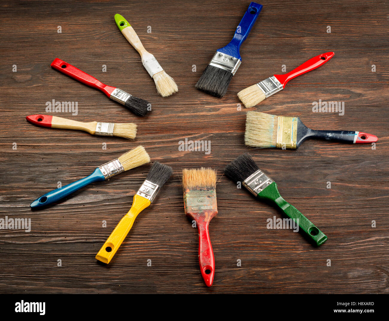 Set of paint brush on wooden background top view. Stock Photo
