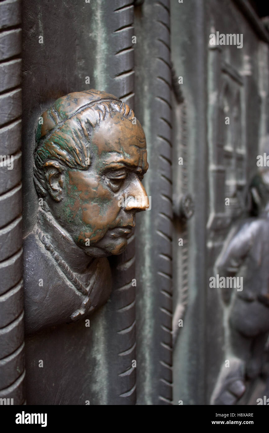 Priest's bust as a decor element of St. Vitus cathedral's door Stock Photo