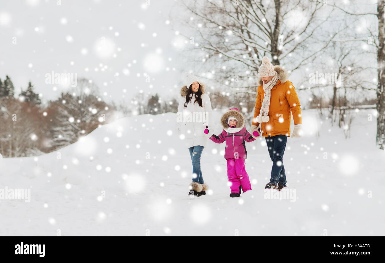 happy family in winter clothes walking outdoors Stock Photo - Alamy