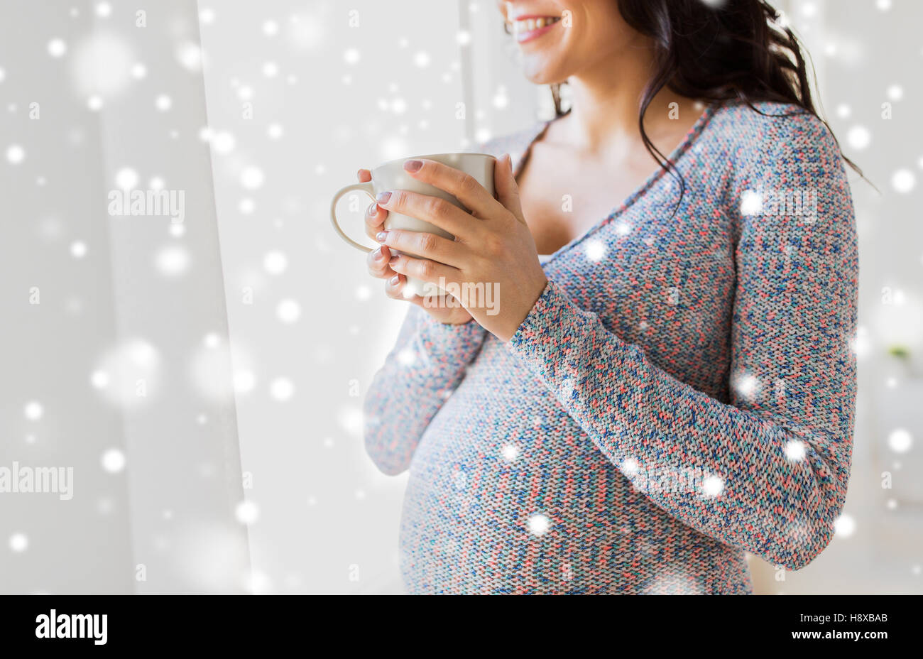 close up of pregnant woman with tea cup at window Stock Photo - Alamy