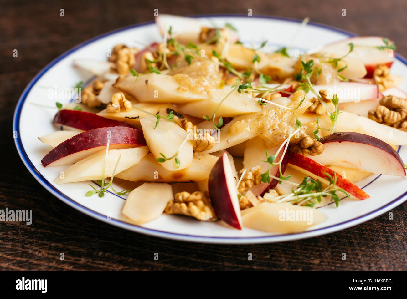 Black Salsify, Apple Salad with Walnuts and Quince Dressing Stock Photo Alamy