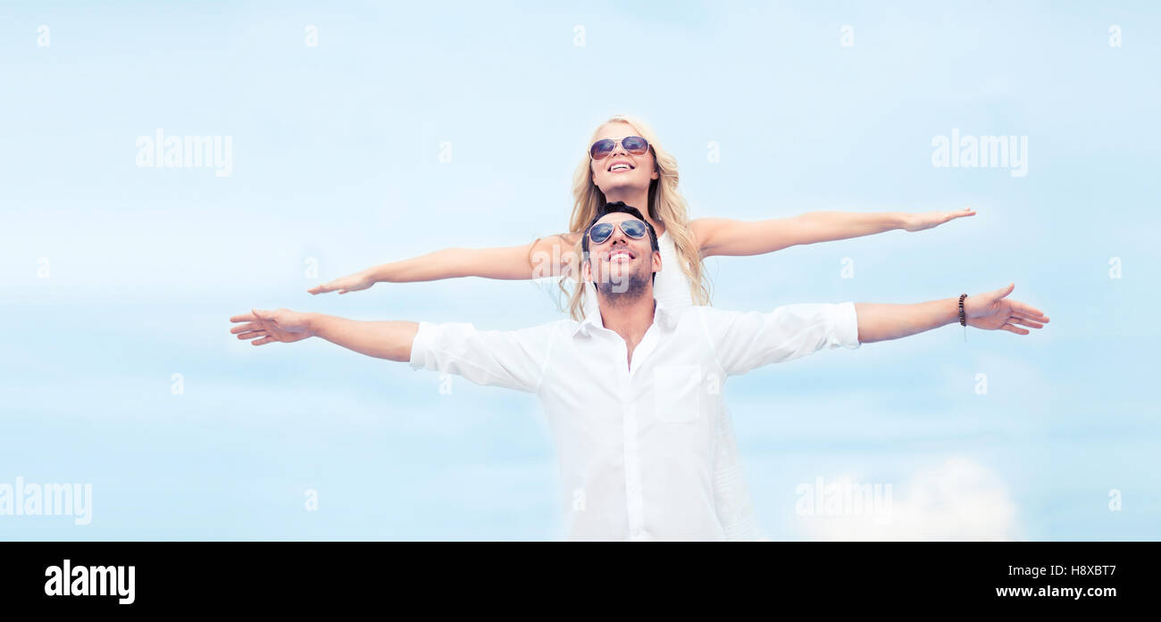 couple holding hands up at sea side Stock Photo - Alamy