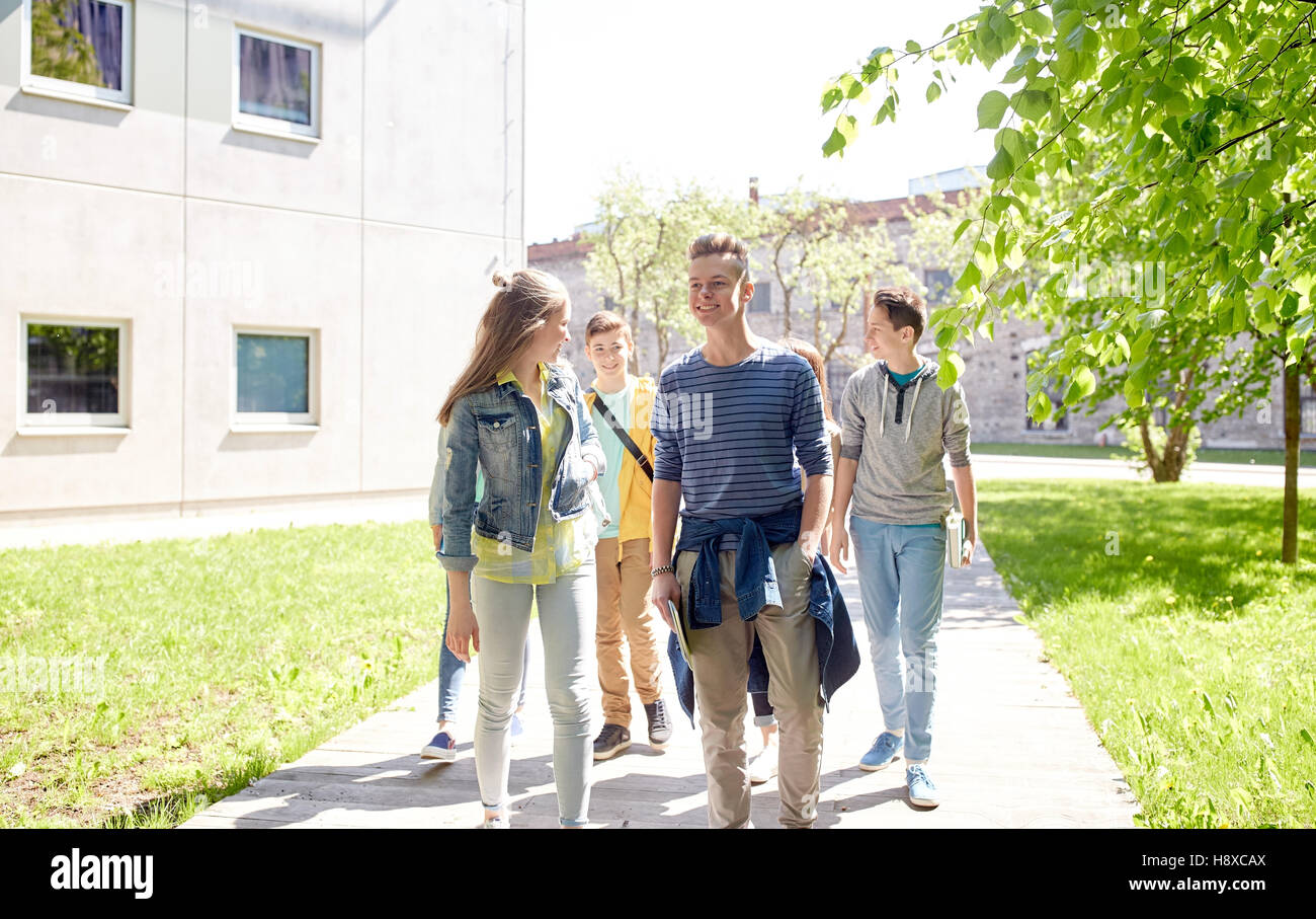 group of happy teenage students walking outdoors Stock Photo - Alamy