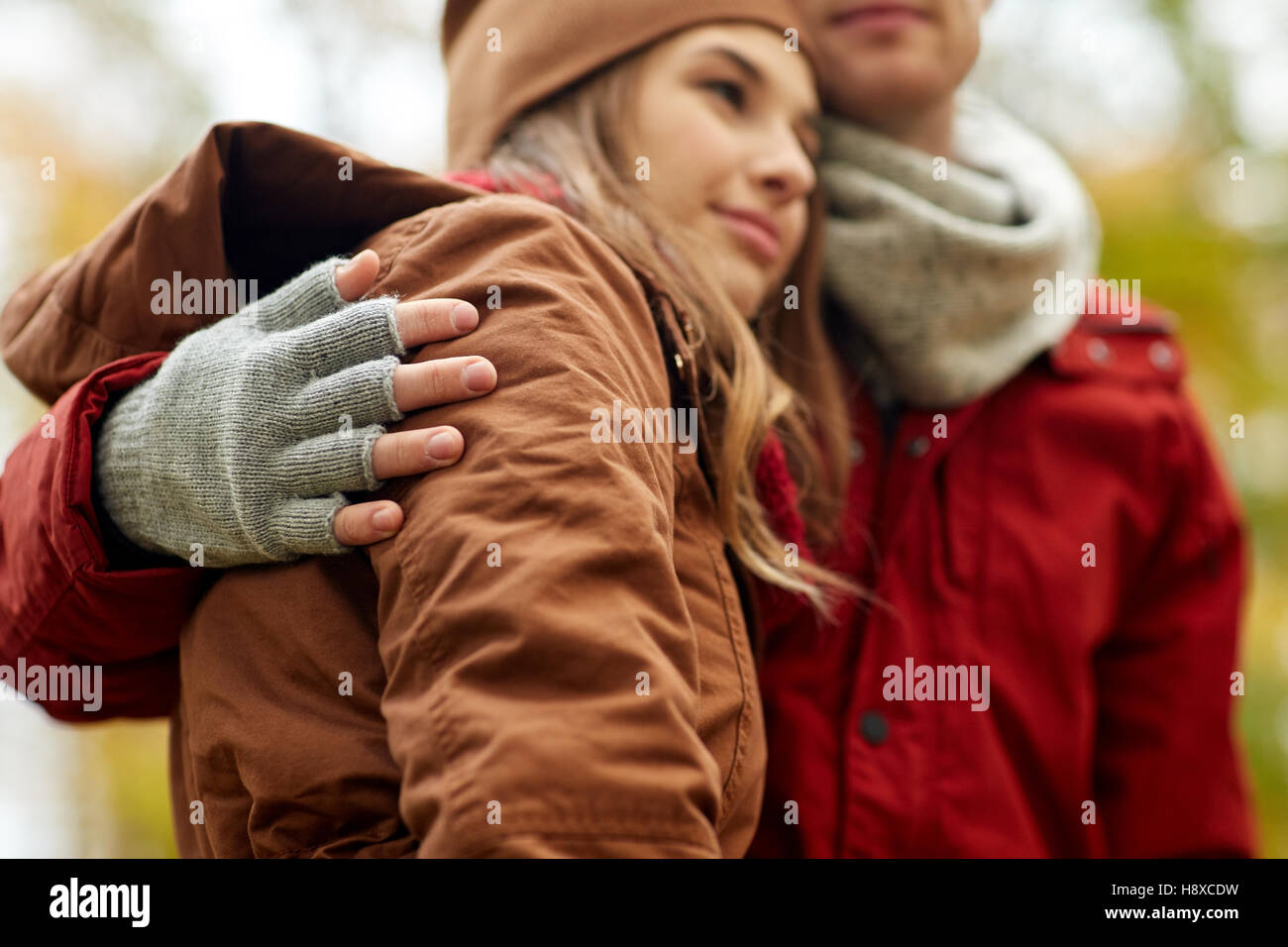 close up of happy couple hugging in autumn park Stock Photo - Alamy