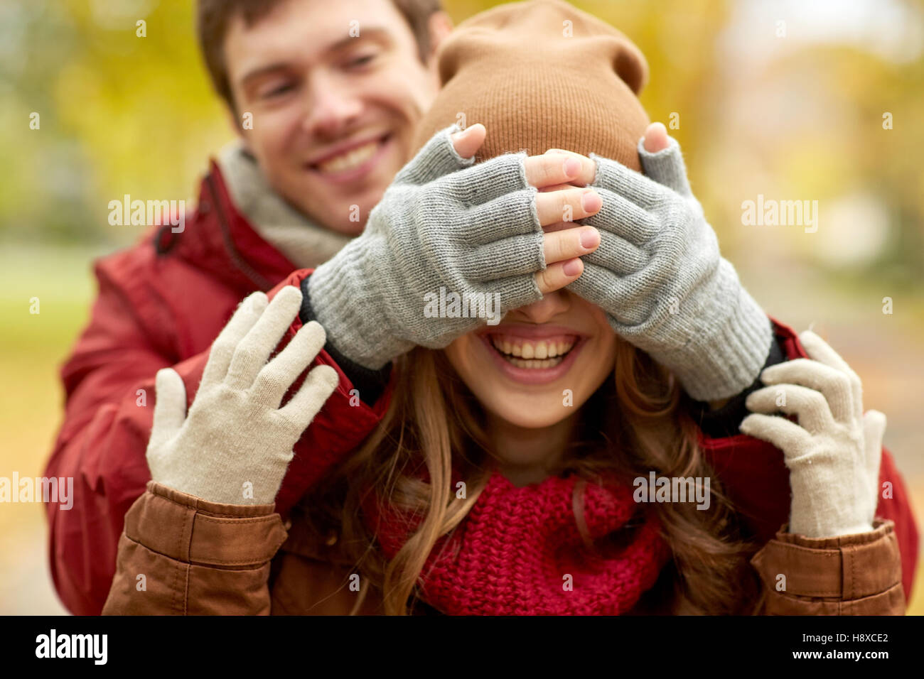 happy young couple having fun in autumn park Stock Photo - Alamy
