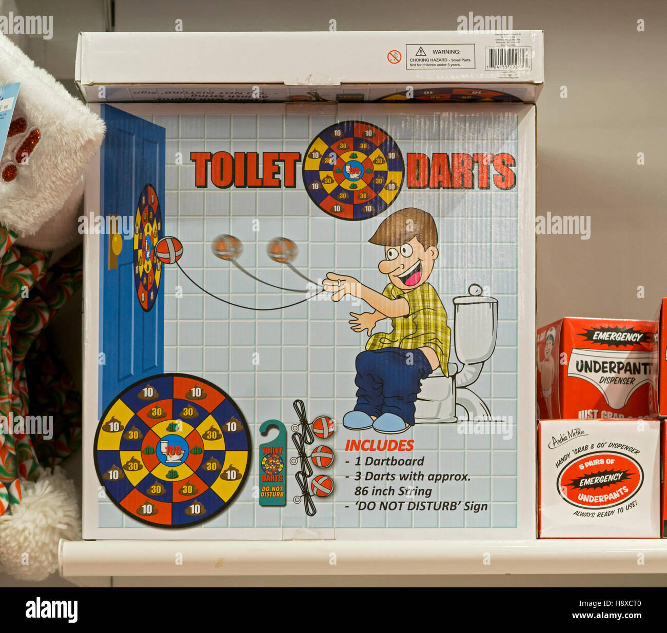 Toilet Darts game for sale at It'sugar, a candy by the pound chain store,  this one being on Broadway in Greenwich Village Stock Photo - Alamy