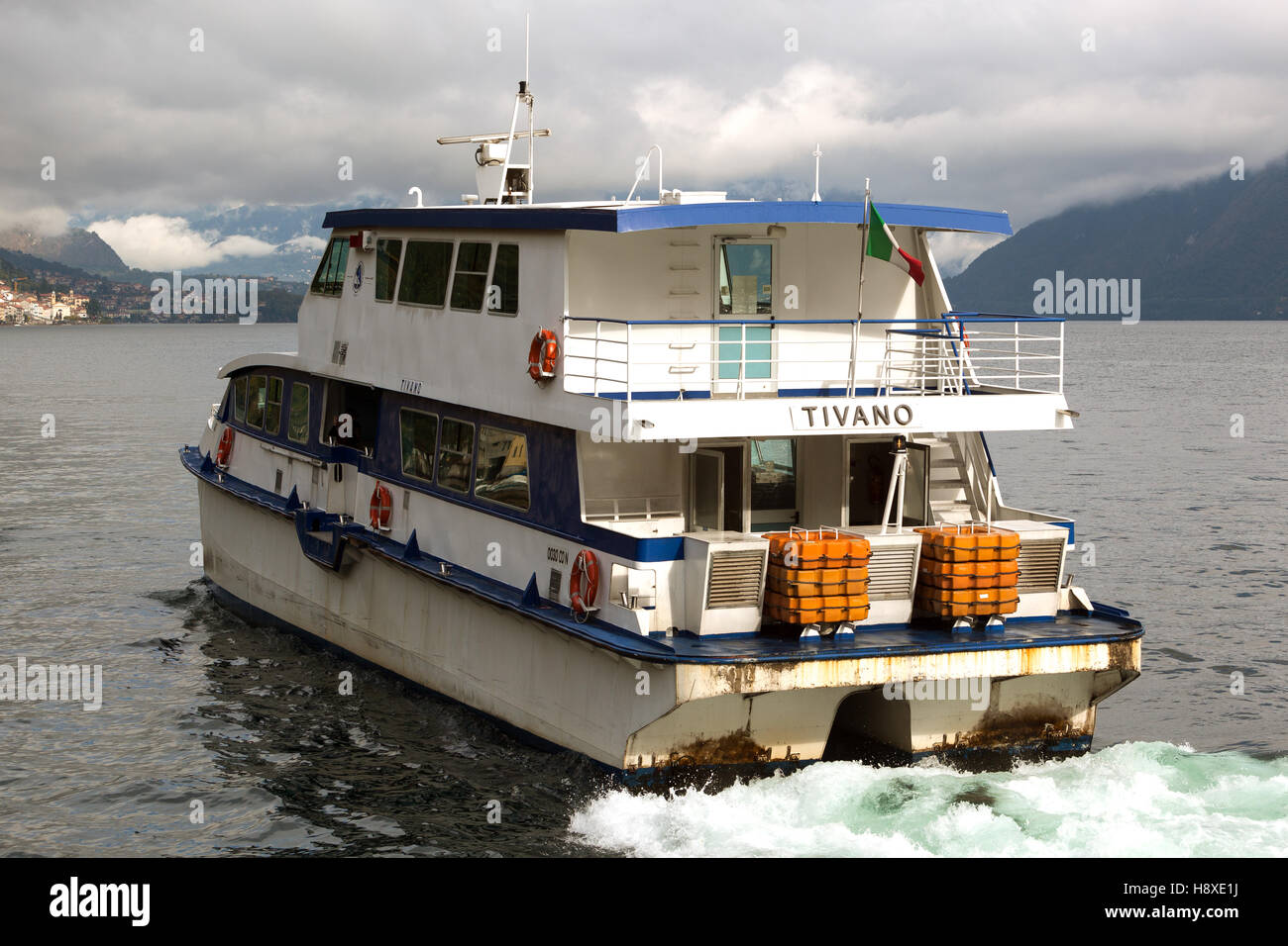Ferry sailing Argegno Lake Como into rainy weather. Italy Stock Photo