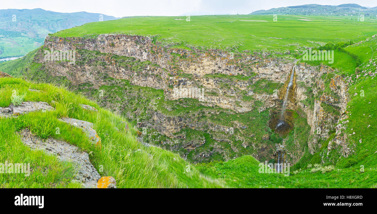 The highland stream flows down from the steep slope of the tableplain, Saro, Georgia. Stock Photo
