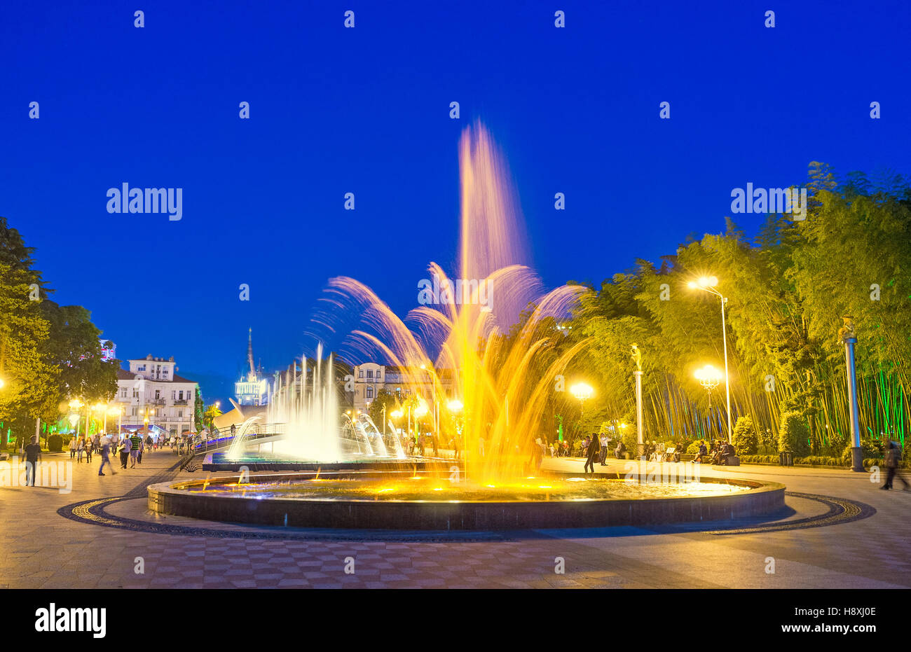 The bright dancing fountains in the Seaside Park create the beautiful figures in the air, Batumi, Georgia. Stock Photo