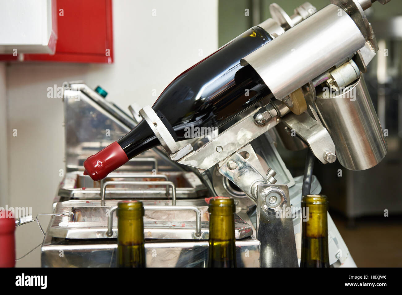 Sealing bottles of wine at the winery Stock Photo