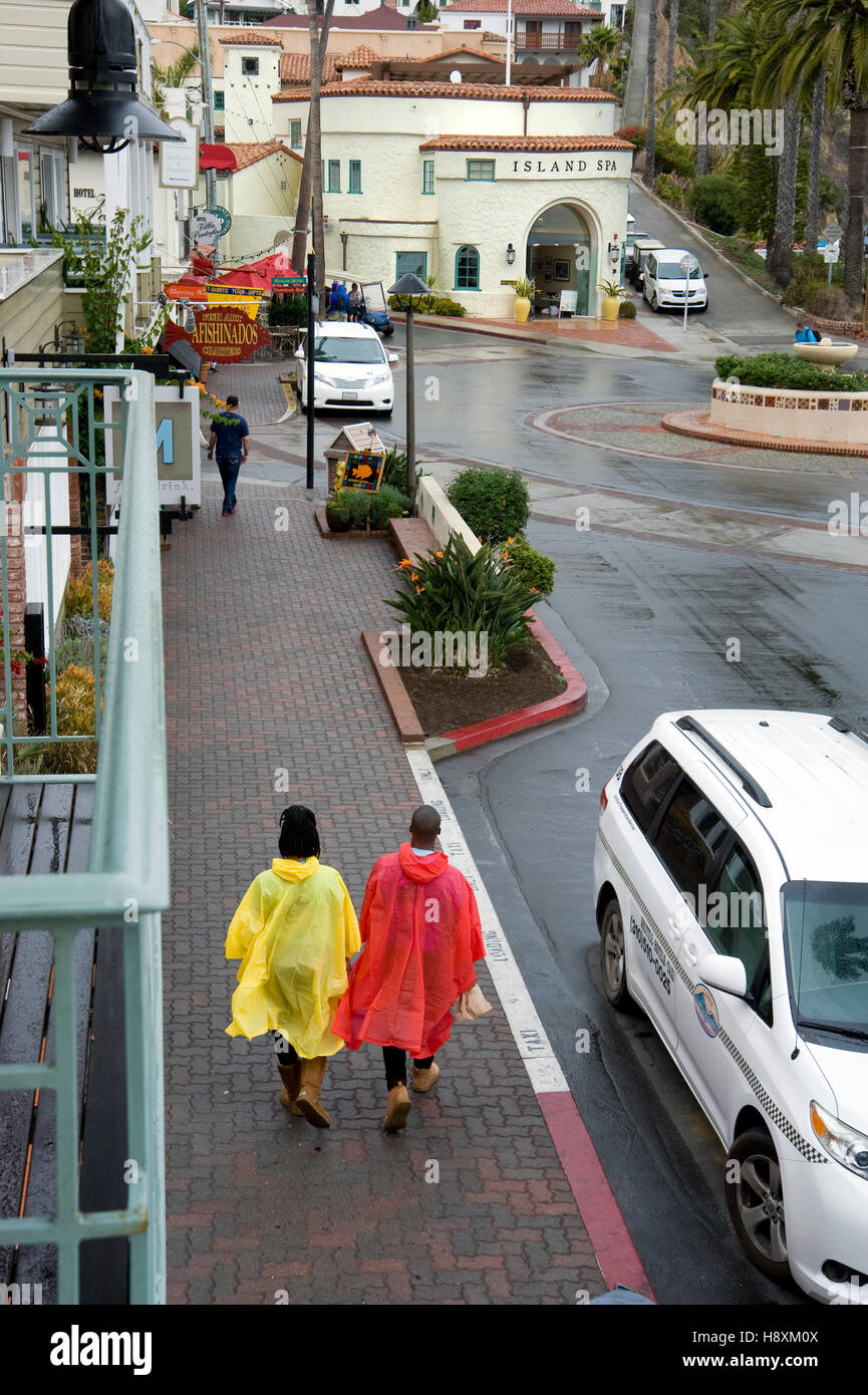 Visitors stroll the main street of Avalon on a rainy day on Catalina Island off the coast of Southern California Stock Photo