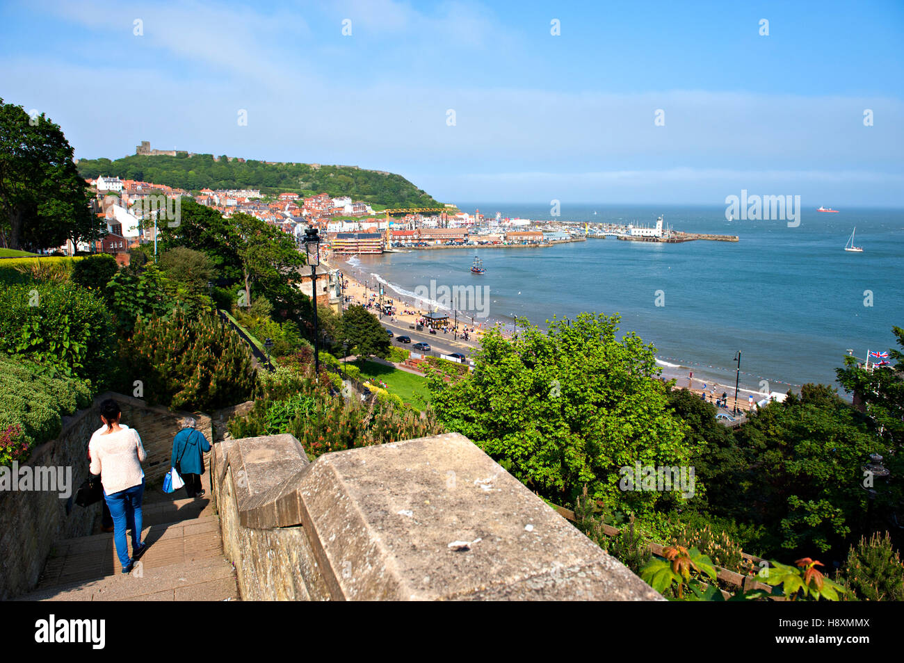 Looking towards South Bay, Scarborough, UK with walkers descending the