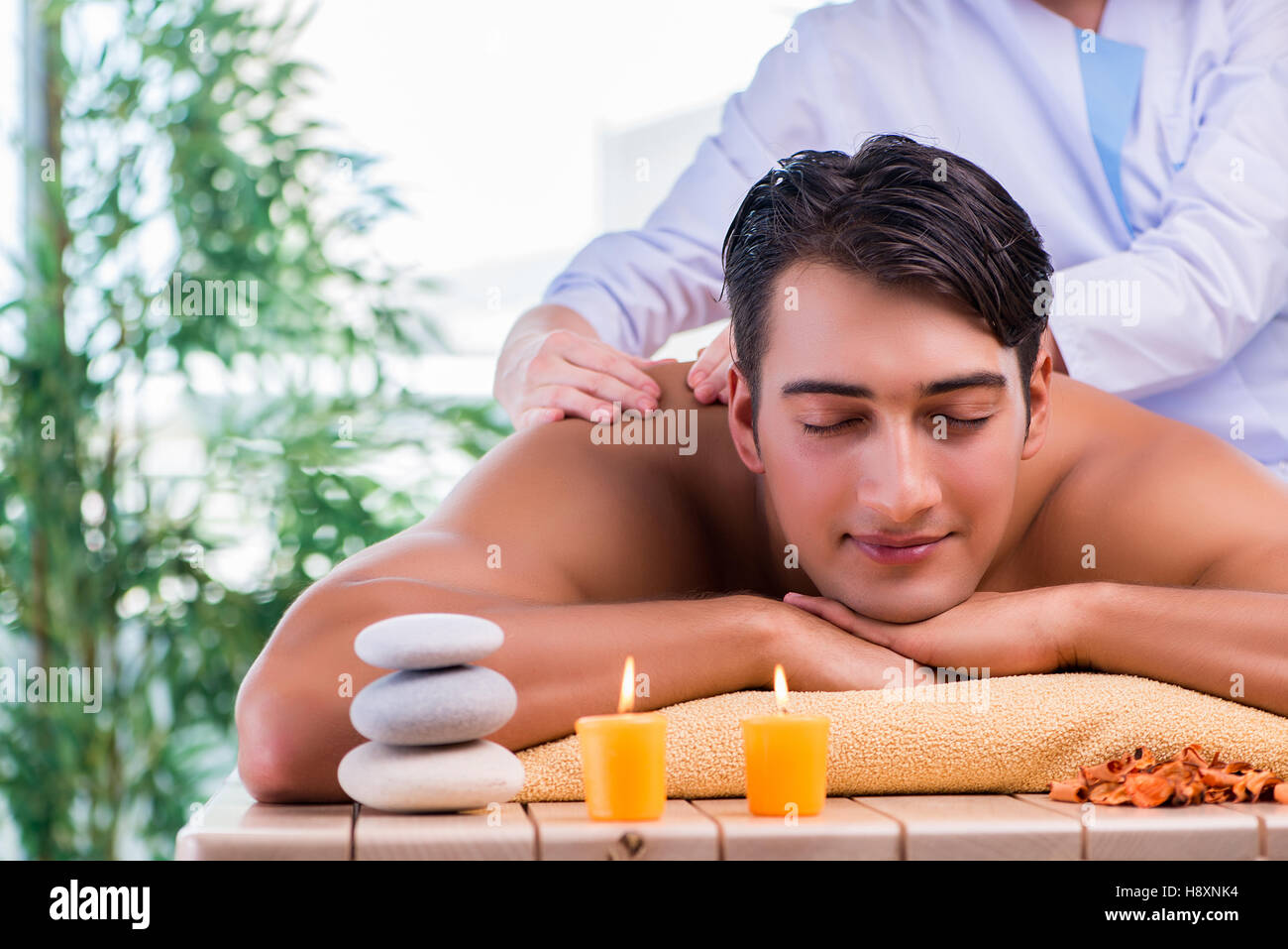 Man during massage session in spa salon Stock Photo Alamy