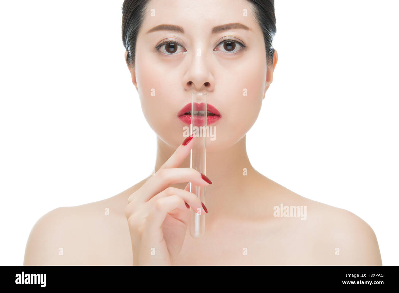 fashion asian woman red lips nail and holding chemistry test lab tube