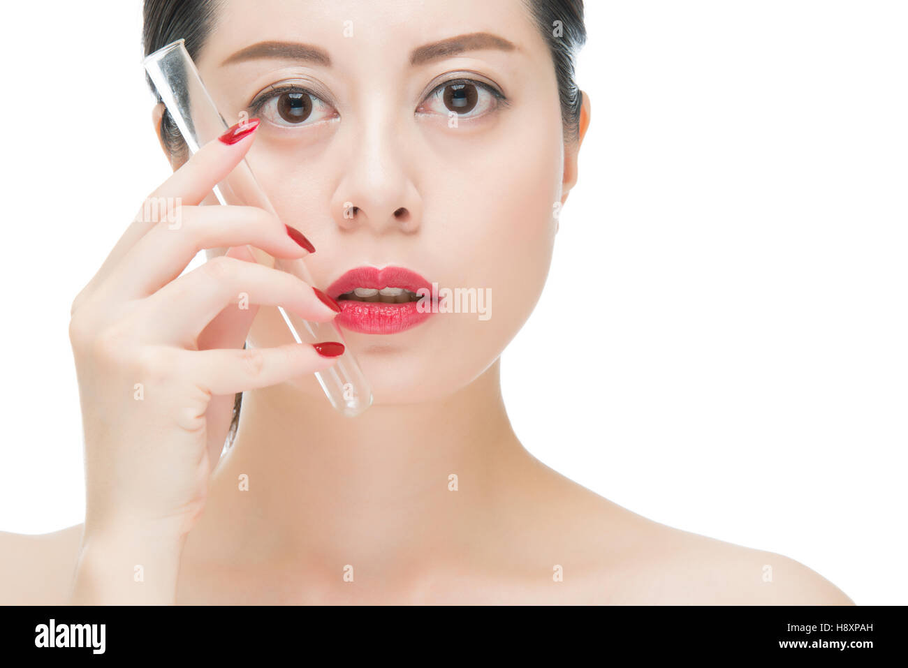 fashion asian woman red lips nail and holding chemistry test lab tube