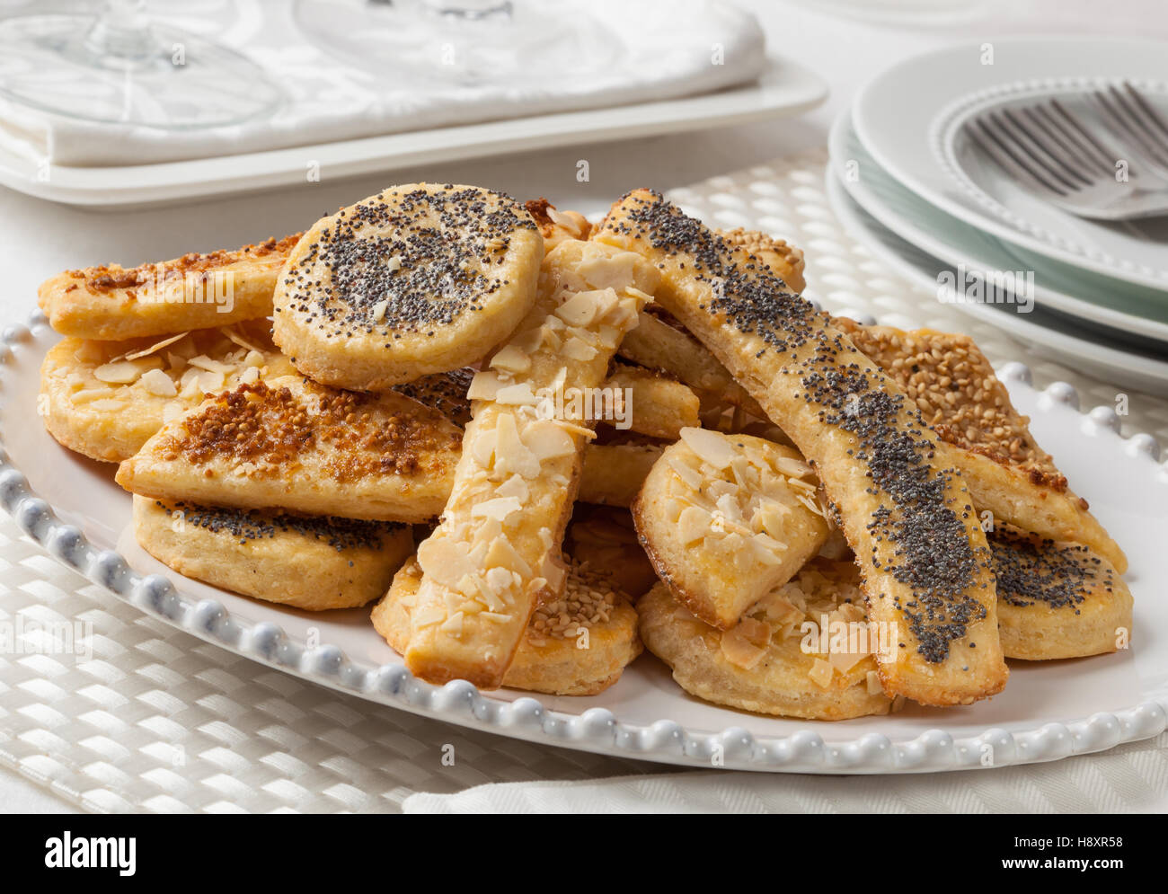 Homemade salty cheese cookies covered with sesame and poppy seeds. Stock Photo