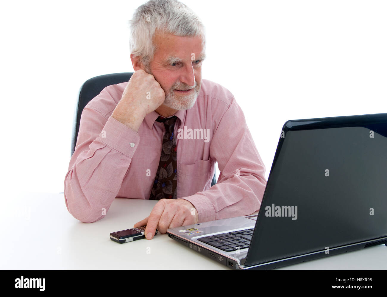 Senior citizen, 60+, working on a laptop Stock Photo Alamy