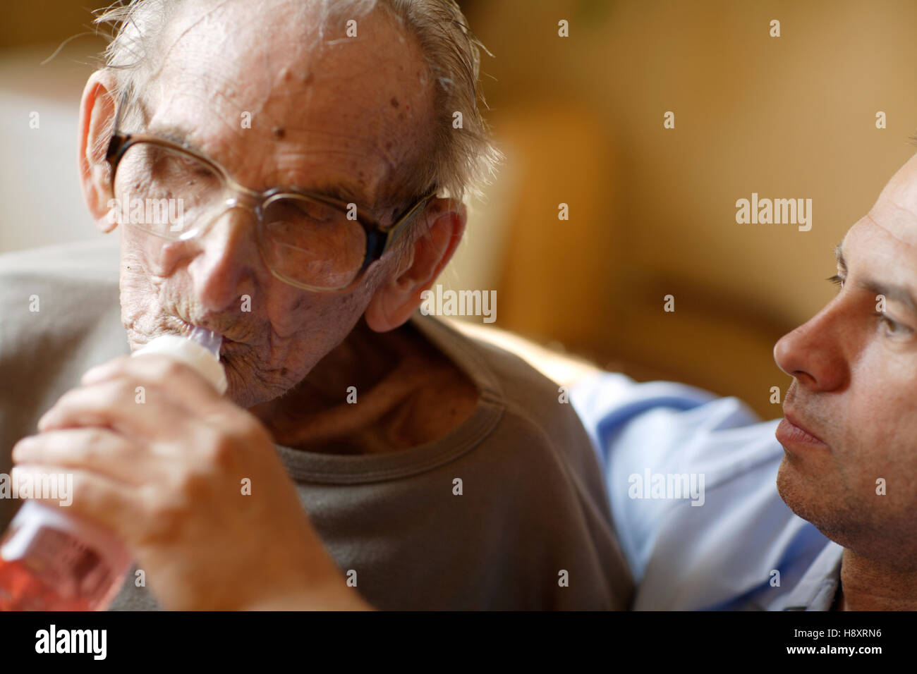 Nursing home, elderly man with a male nurse Stock Photo