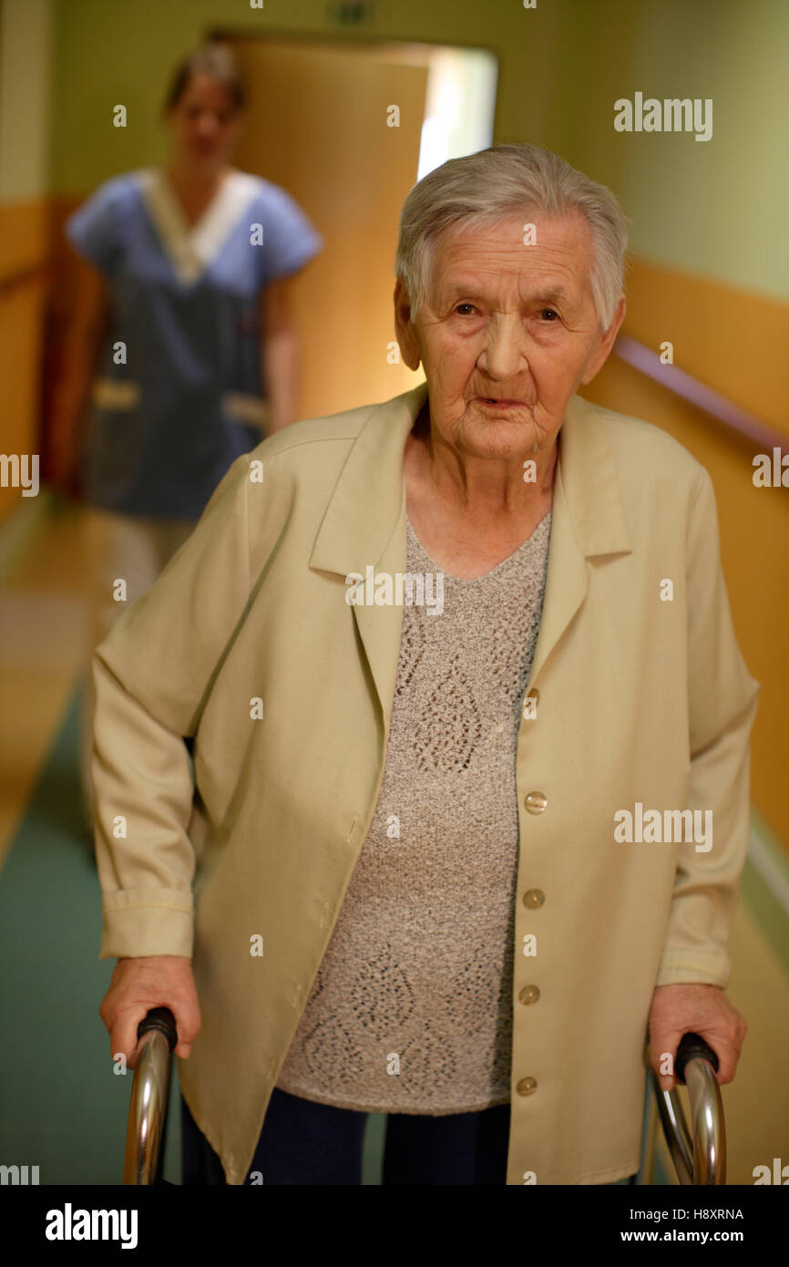 Nursing home, elderly woman with a nurse Stock Photo