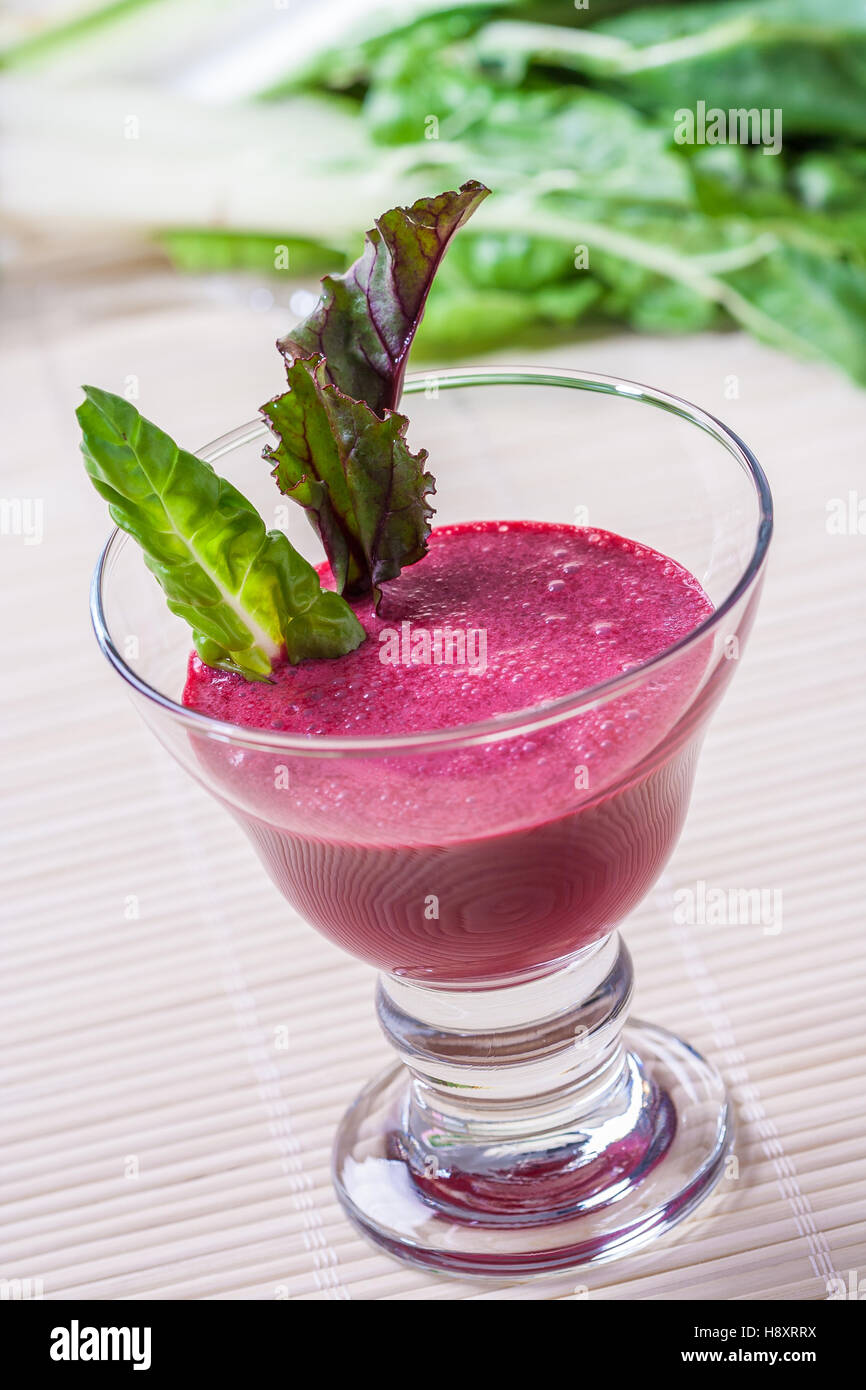 Fresh beet juice with leaves in a glass Stock Photo