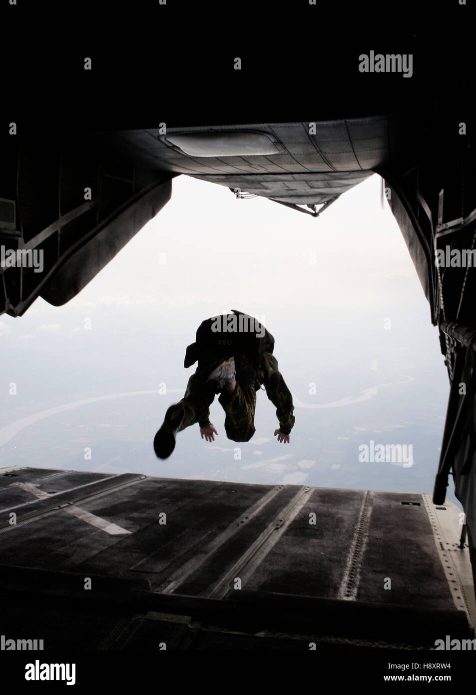 Army soldier jumping from helicopter hires stock photography and