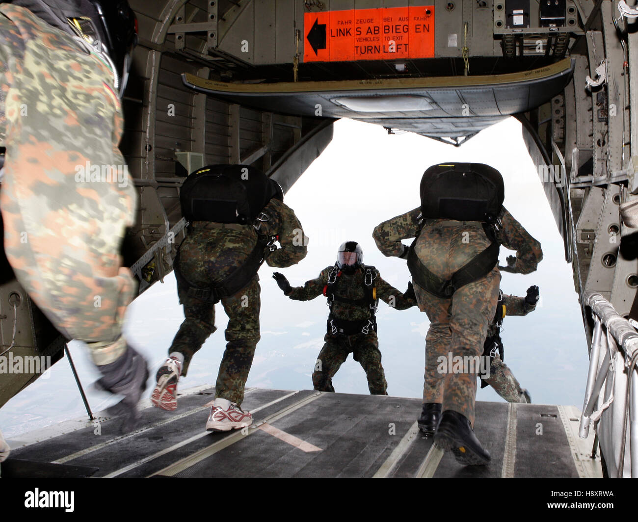 Paratroopers jumping from the rear hatch of a helicopter, 13th International Paratrooper Competition of the Special Operations Stock Photo
