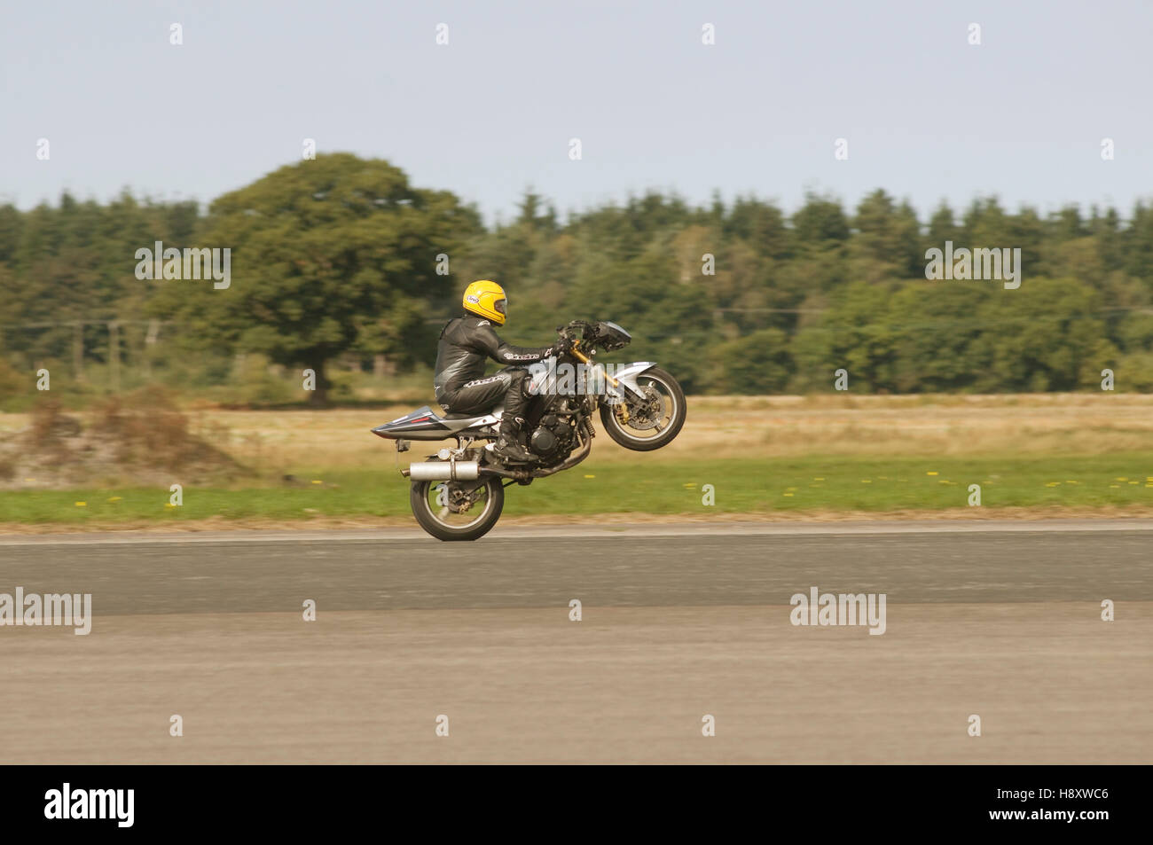 motorcycle pulling a wheelie Stock Photo