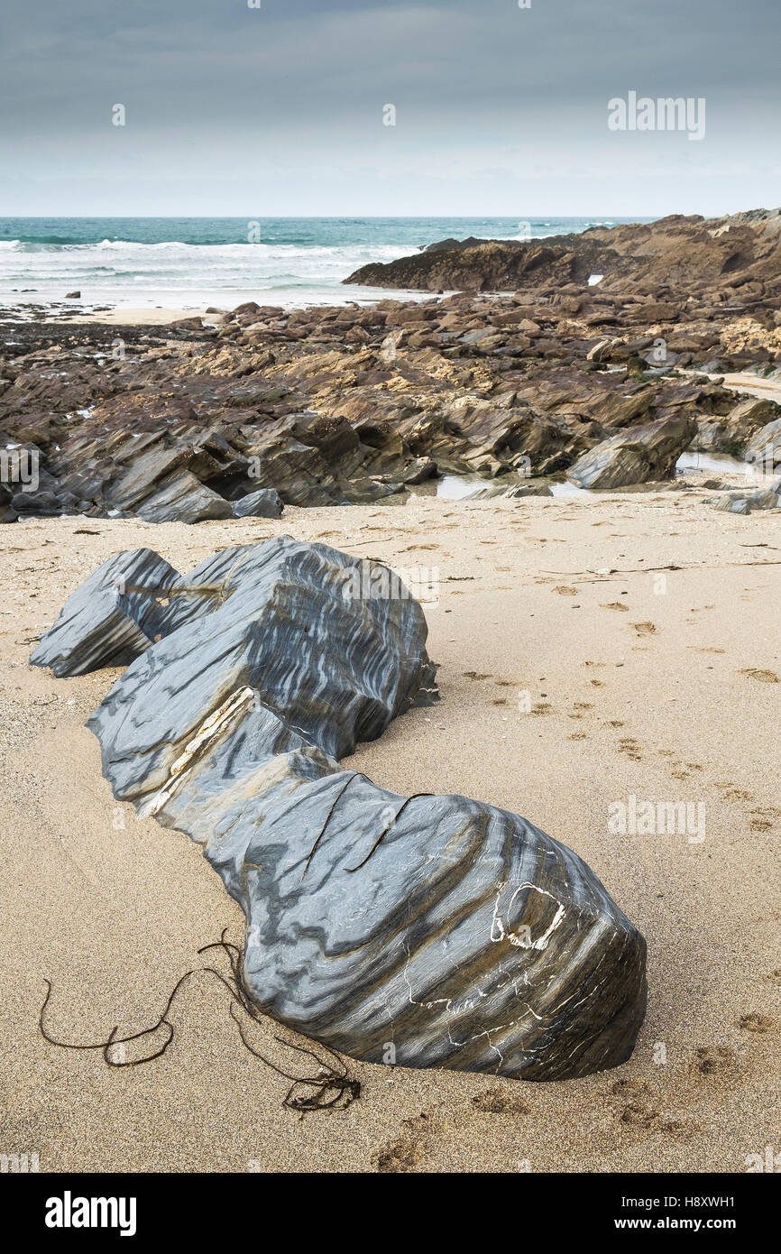 Rocks exposed at low tide on Little Fistral Beach in Newquay, Cornwall