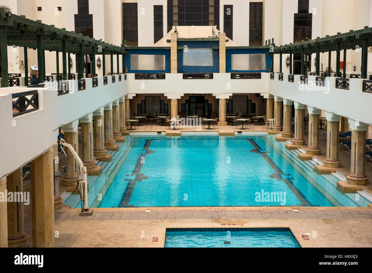 Swimming Pool With Columns In Antique Style Next To A