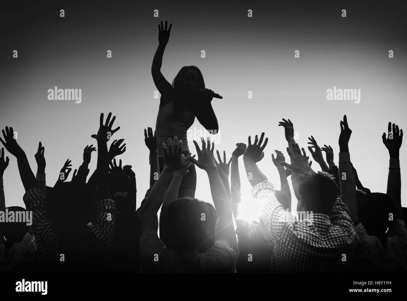Silhouettes of People at Outdoors Music Festival Stock Photo