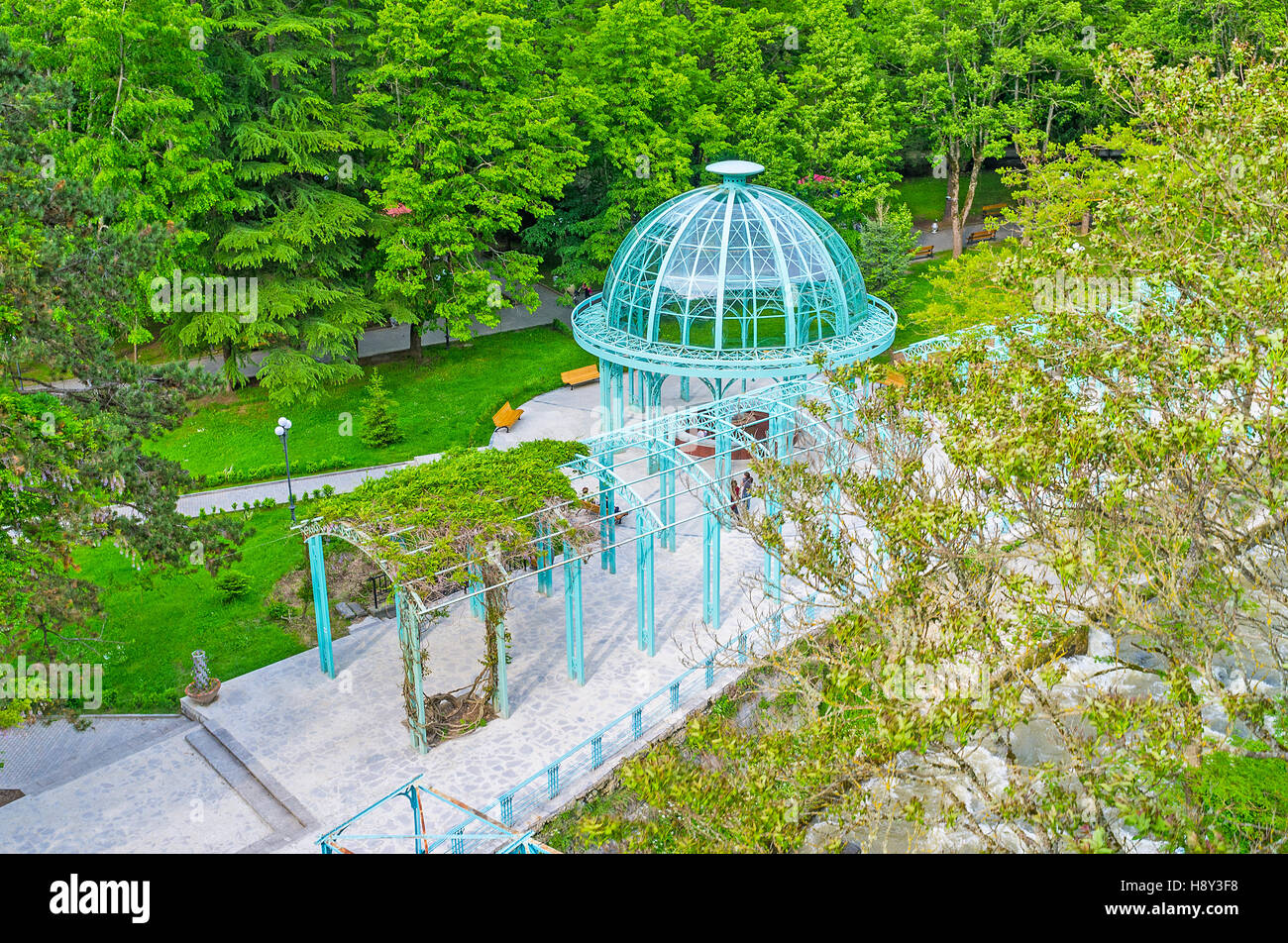 The blue pavilion of hot mineral water source in historic park of Borjomi resort, Georgia. Stock Photo