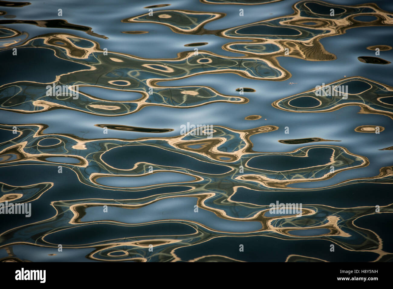 Waves, water, water ripples, gold water ripples Stock Photo - Alamy