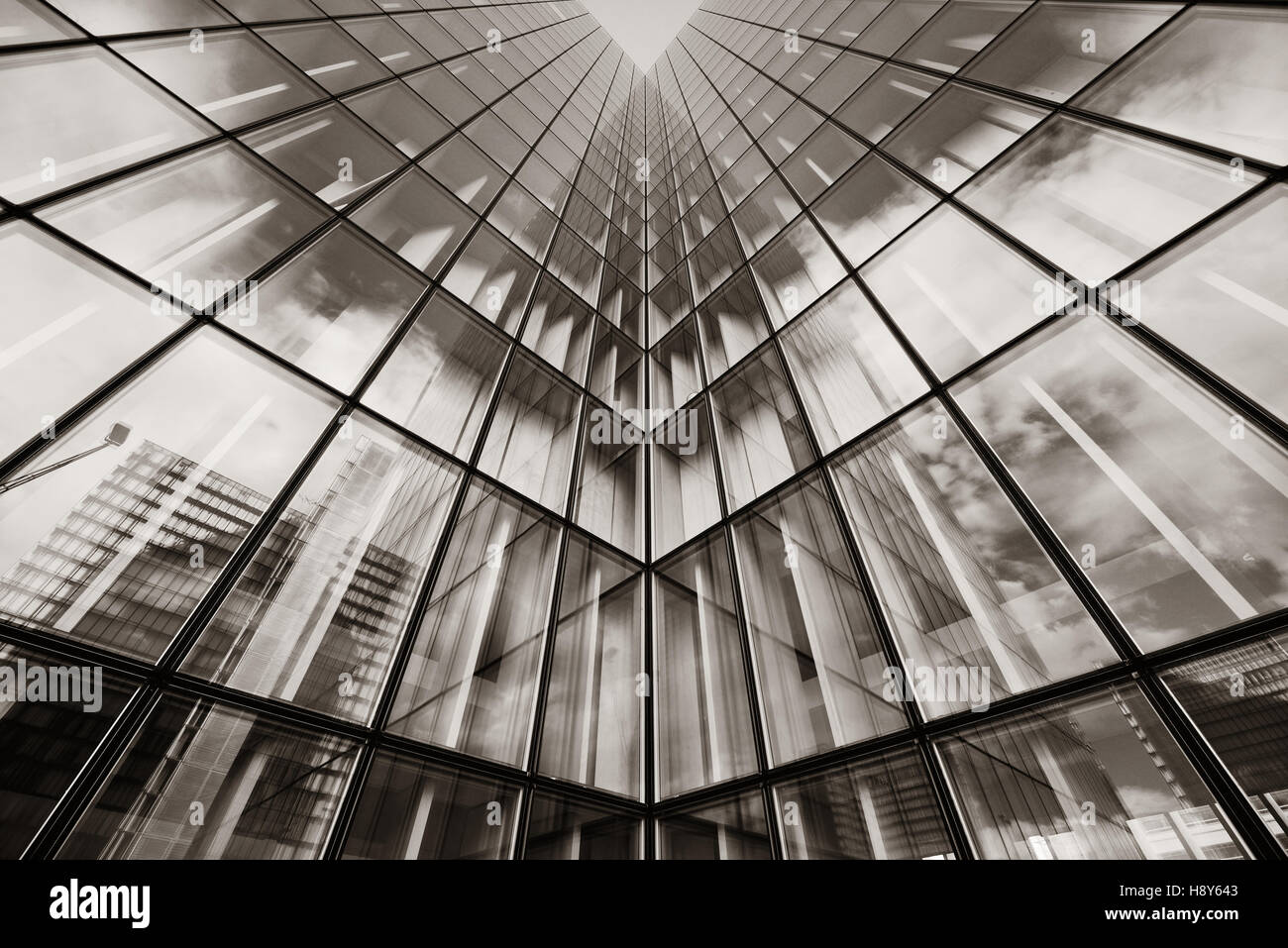 Glass reflection of skyscraper in Paris Stock Photo - Alamy