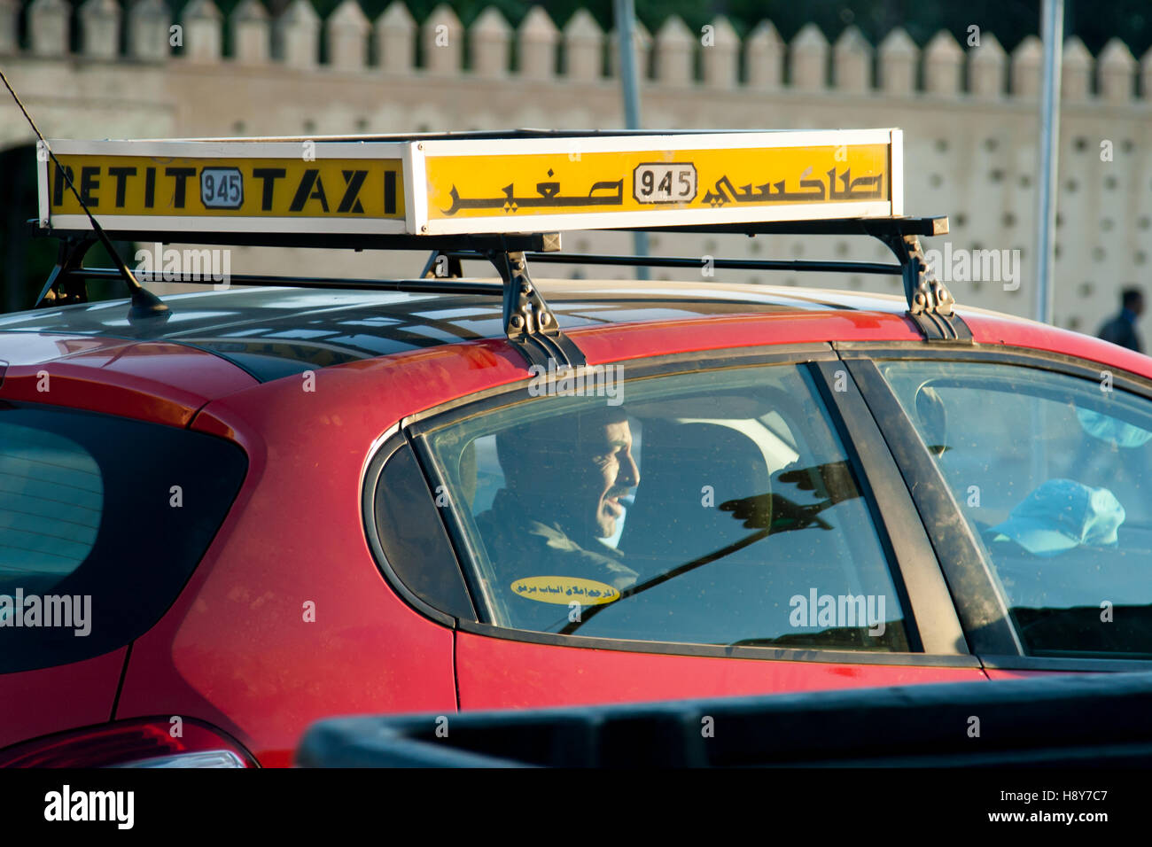 Red petit taxi of Fès, Morocco. The small red taxis are particularly cheap in Fez Stock Photo