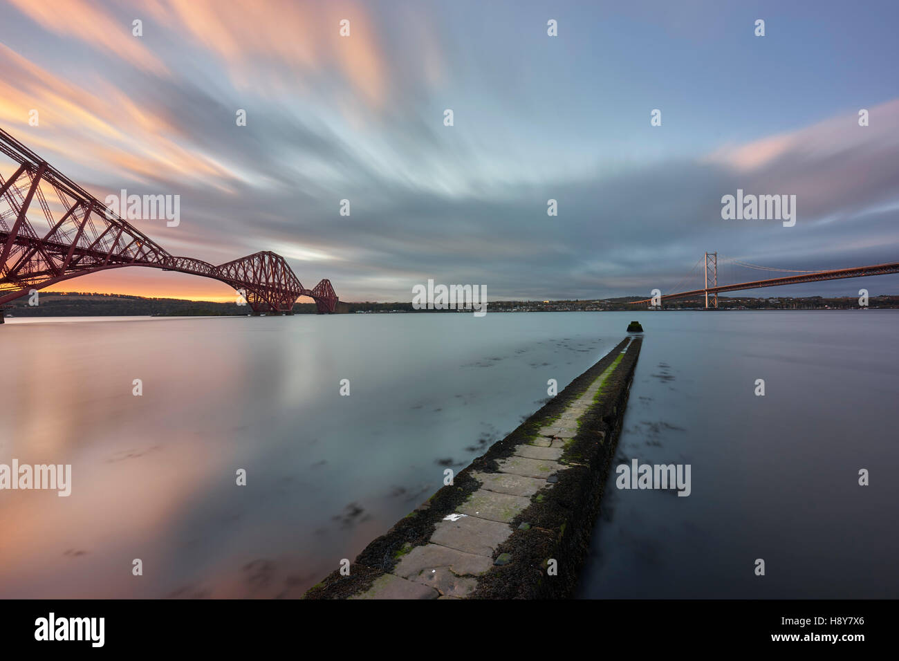 The Forth Rail and Road Bridge from North Queensferry, Fife, Scotland.  At sunrise. Stock Photo