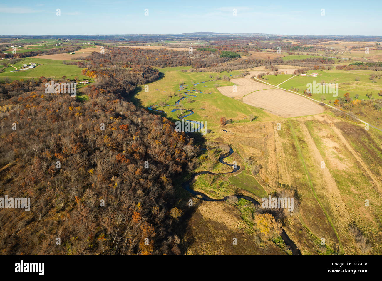 Aerial photograph of rural Wisconsin on a beautiful autumn day. Blue Mound State Park is on the horizon. Stock Photo