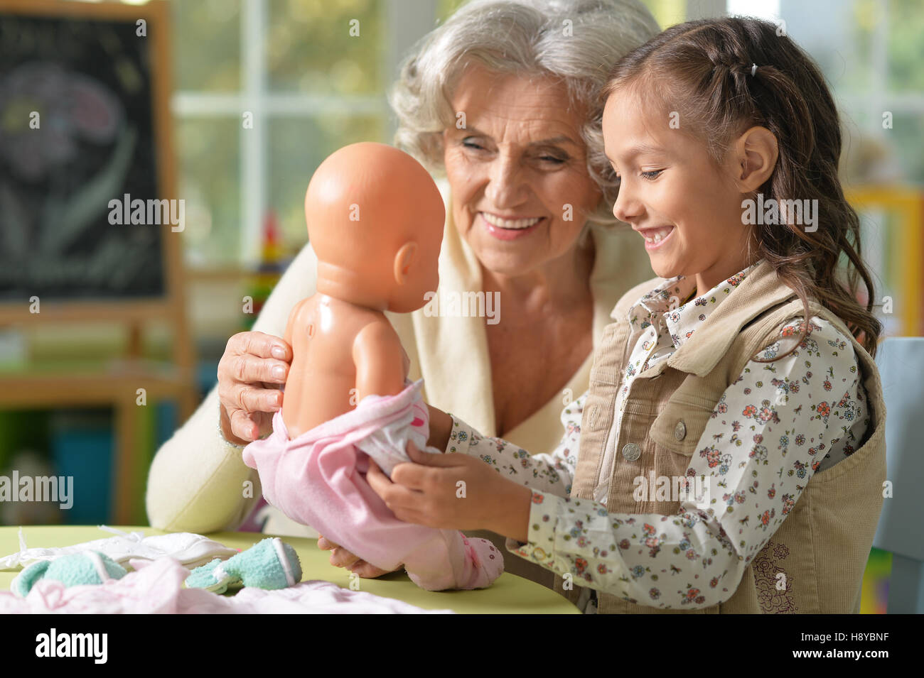 Grandmother and child play Stock Photo