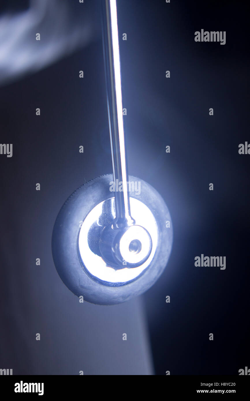 Doctor's reflex hammer tool used to test patient reflexes in knee and