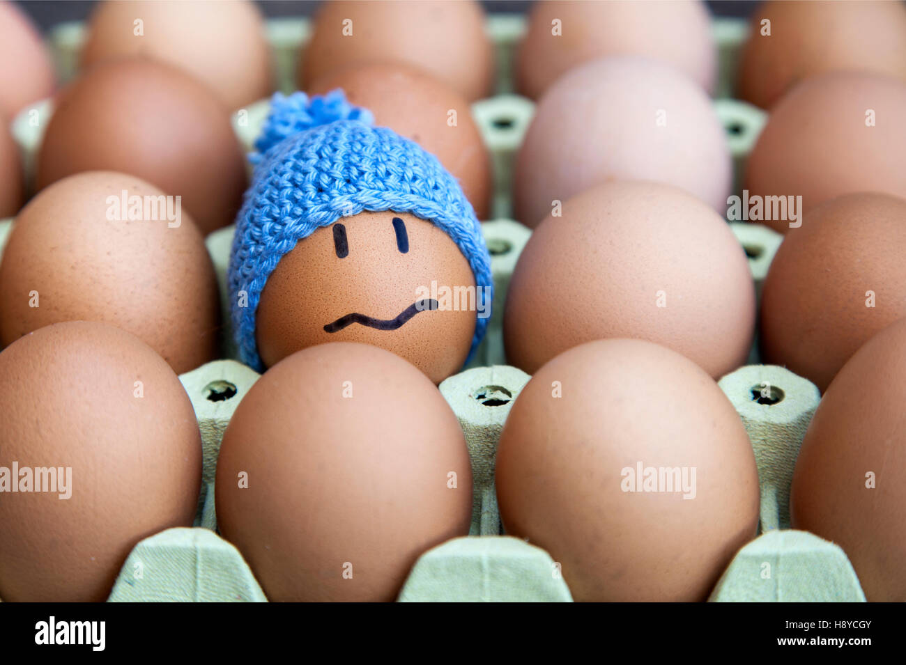 Unhappy in winter concept presented with egg character. Other possible concepts are: In troble, lost, problems, etc... Stock Photo