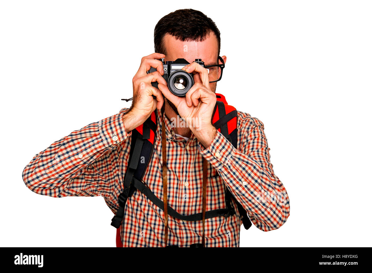 Man tourist backpacker on trip taking photo picture with camera. Stock Photo
