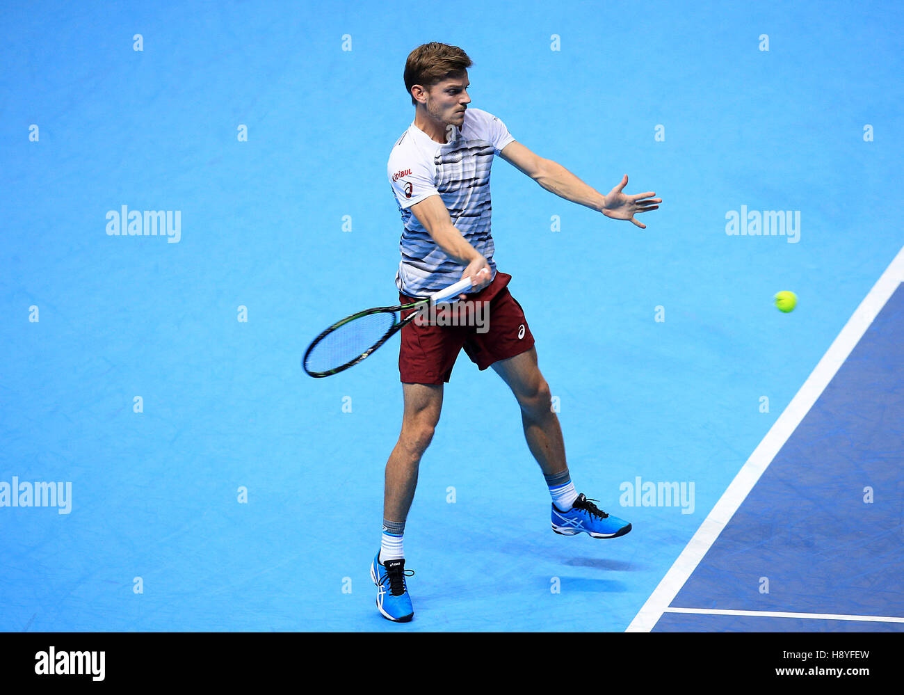 David Goffin in action against Novak Djokovic during day five of the Barclays ATP World Tour Finals at The O2, London. Stock Photo
