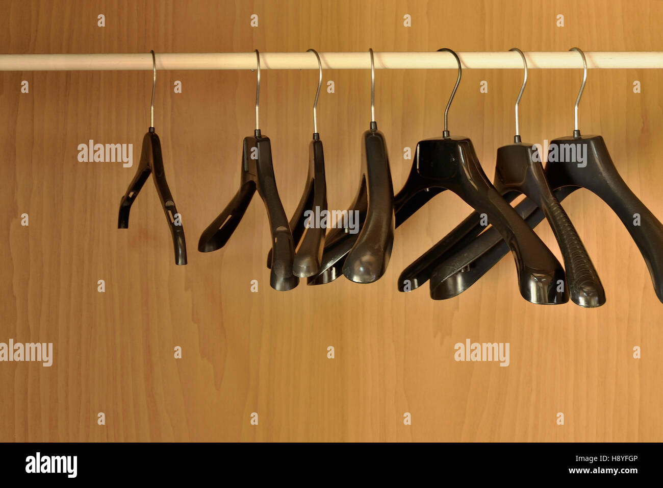 Black hangers in the closet Stock Photo Alamy