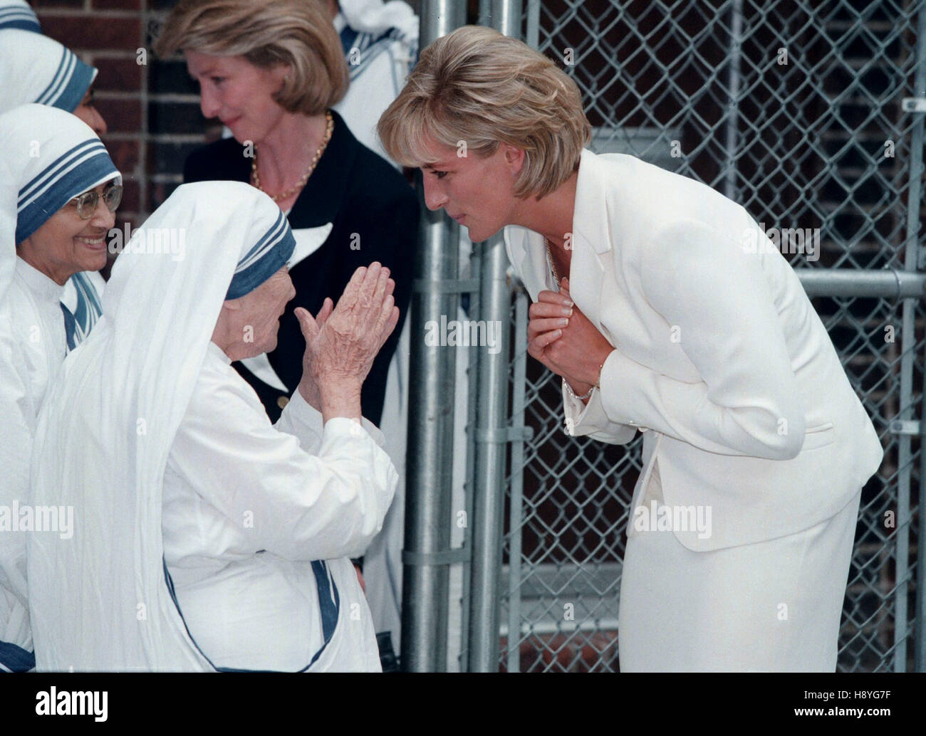 Princess Diana, right greets Mother Teresa at the Missions of Charity in the Bronx, New York on June 18, 1997. Photo by Francis Specker Stock Photo