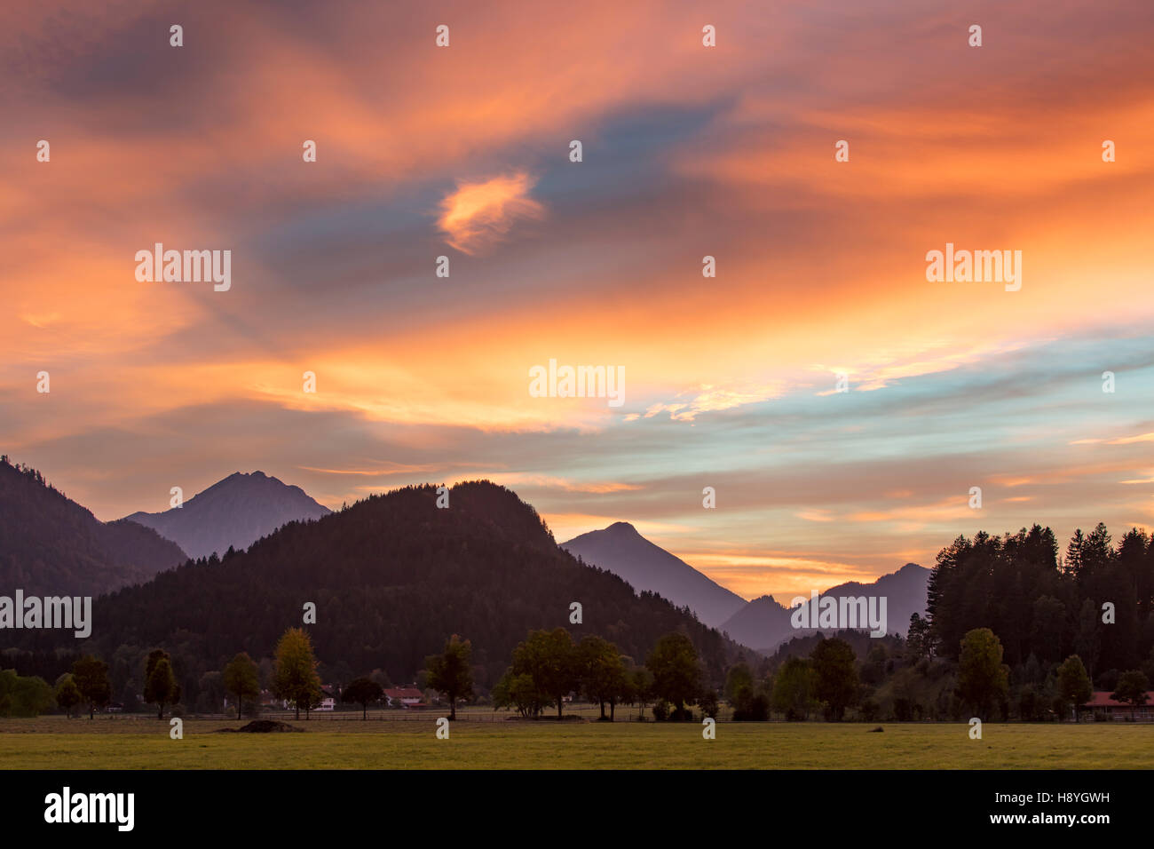 Colorful alto sunset over the foothills of the Bavarian Alps near Fussen, Bavaria, Germany Stock Photo