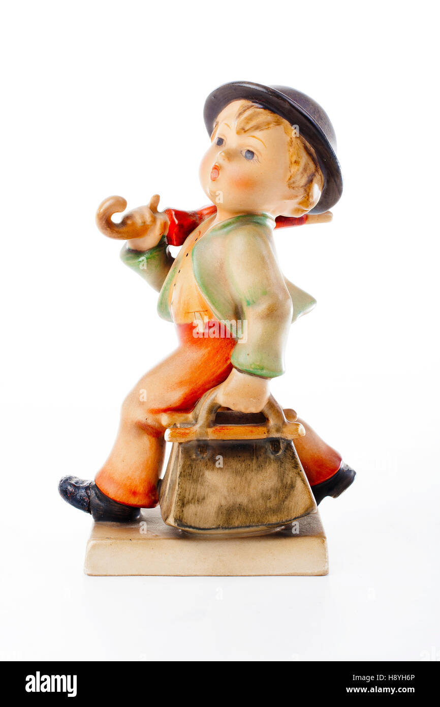 Hummel Goebel figurine. Antique ceramic porcelanic little boy with bag and  umbrella "Merry Wanderer' ceramic porcelanic 1950 Stock Photo - Alamy