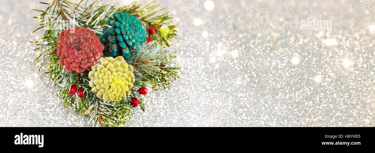 Pinecones and fir tree on sparkling background. Christmas decoration background Stock Photo