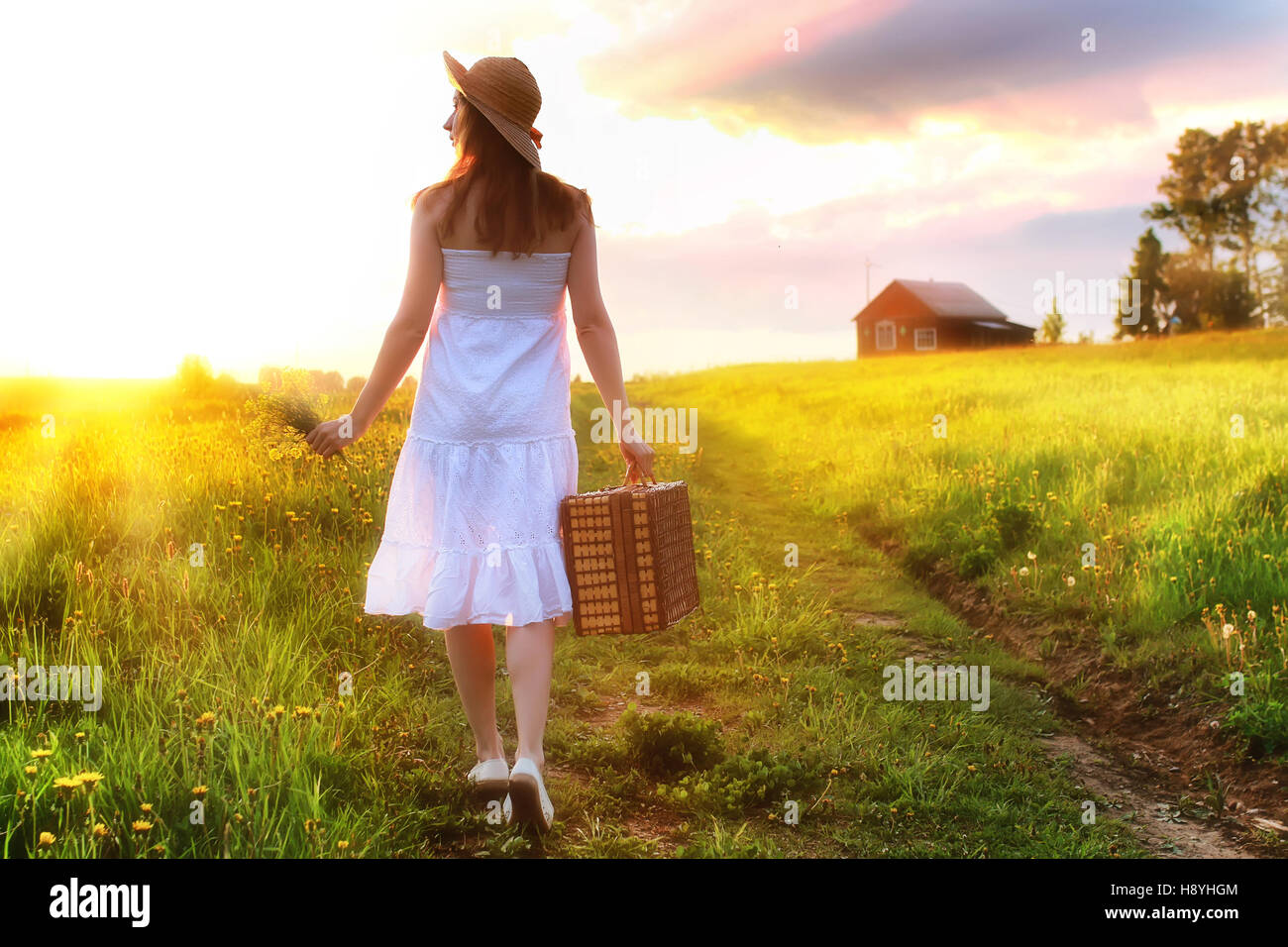 girl at sunset field Stock Photo - Alamy